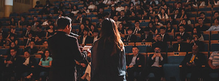 a man giving a speech at the ceremony