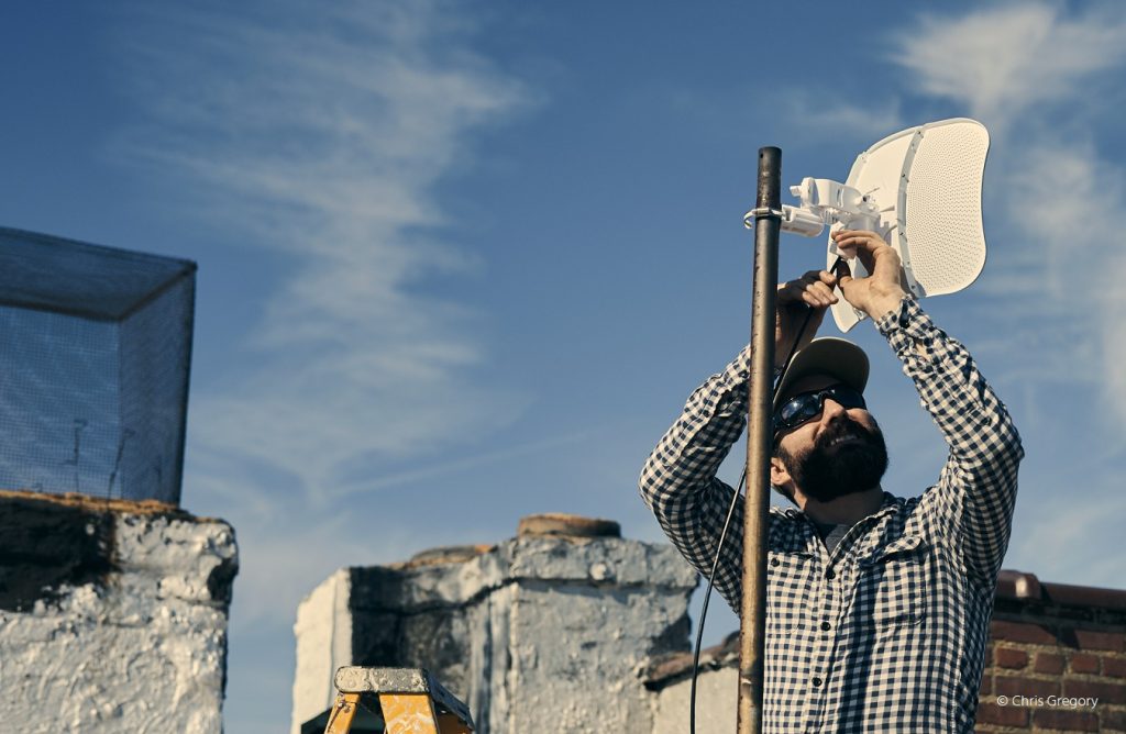 A man installing antenna