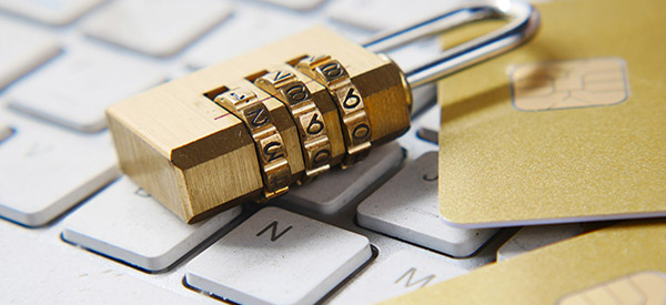 A padlock on white keyboard