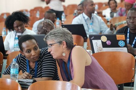 Two women talking at the conference