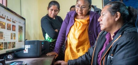 Group of women browsing the Internet on a computer