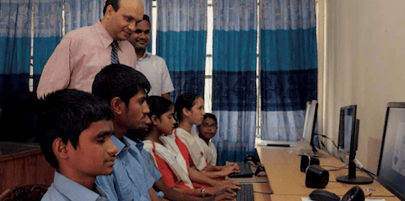 Boys and girls working at computers